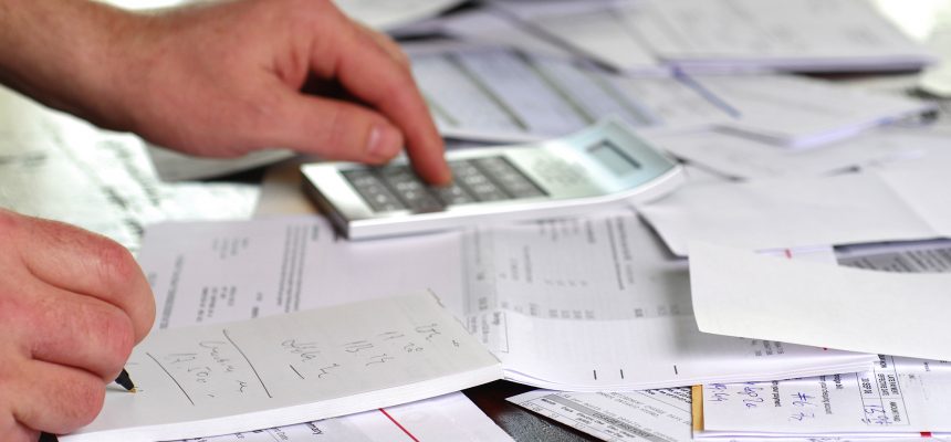 A large amount of bills spread all over the place