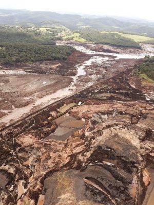 An aerial view shows the area of a collapsed dam in Brumadinho, Brazil, Saturday, Jan. 26, 2019. Rescuers searched for survivors in a huge area in southeastern Brazil buried by mud from the collapse of dam holding back mine waste, with several people dead and hundreds missing.  (AP Photo/Andre Penner)